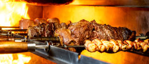 Caption: Sizzling Churrasco Being Grilled In Rio Grande Wallpaper