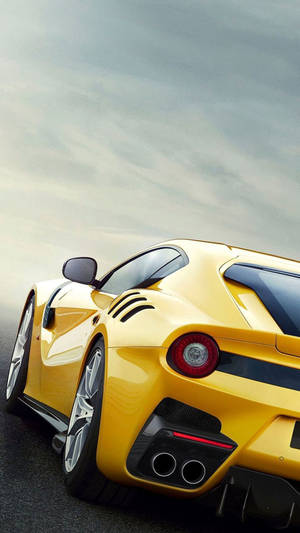 Caption: Sleek Ferrari Phone With Signature Red Detailing Wallpaper