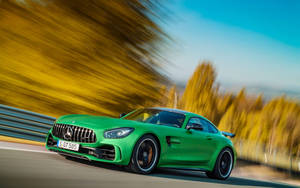 Caption: Sleek Green Hell Magno Mercedes-amg Gtr Showcasing Power And Style Wallpaper