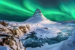 Caption: Stunning Aurora Borealis Lighting Up The Night Sky Wallpaper