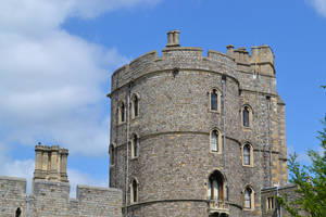 Caption: Stunning Prospect Of Windsor Castle Against Azure Skies Wallpaper