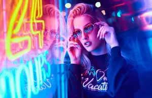 Caption: Stylish Aviator Sunglasses Reflecting The Beauty Of Nature Wallpaper