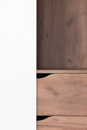 Caption: Stylish Solid Pastel Color Wooden Cabinet Wallpaper