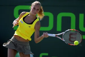 Caption: Talented Tennis Player Daniela Hantuchova Executes A Powerful Return Wallpaper