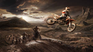 Caption: Thrilling Monster Dirt Bike In Action Wallpaper