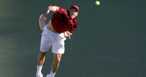 Caption: Tomas Berdych In Action - Smashing The Ball Mid-air Wallpaper