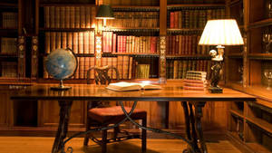 Caption: Traditional Library Desk In An Elegant Setting Wallpaper