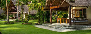 Caption: Tranquil Scene Of A Cozy Home In The Solomon Islands Wallpaper