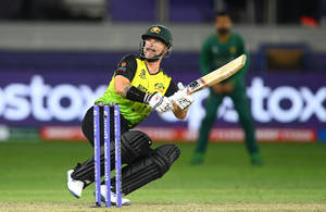 Captivating Action Shot Of Australia Cricket Player, Matthew Wade Wallpaper