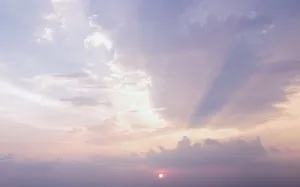 Captivating Aesthetic Clouds Over Tranquil Scenes Wallpaper