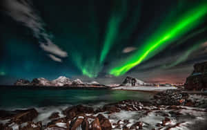 Captivating Aurora Borealis Lights Up The Night Sky Wallpaper