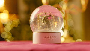 Captivating Harrods Snow Globe In Winter Wallpaper