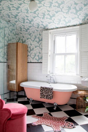 Captivating Pink Bathroom With Classic White Bathtub Wallpaper