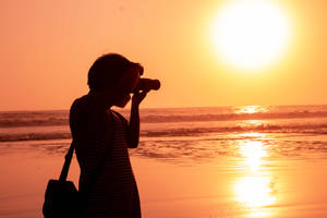 Capture The Beauty Of The Sunset Wallpaper
