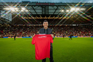 Carlos Casimiro Holding Red Shirt Wallpaper