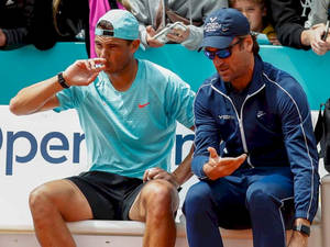 Carlos Moya Gesturing With Rafael Nadal Wallpaper