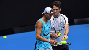 Carlos Moya Giving Balls To Nadal Wallpaper