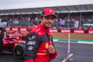Carlos Sainz Jr Giving Thumbs Up Wallpaper