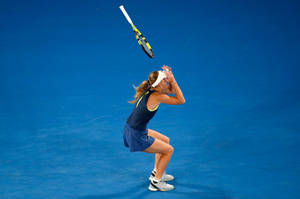 Caroline Wozniacki On Blue Tennis Court Wallpaper