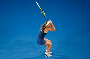 Caroline Wozniacki On Blue Tennis Court Wallpaper