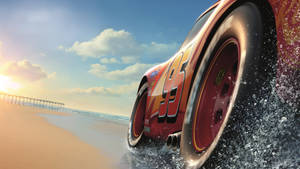 Cars Racing By The Beach Wallpaper