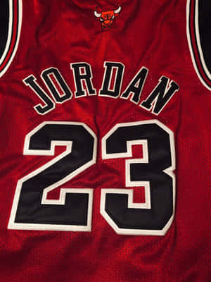 Celebrate Nba Legend Michael Jordan With This Classic Jersey. Wallpaper