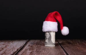 Celebrating A Merry Christmas With Money Wallpaper