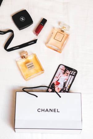 Chanel Aesthetic Products On Bed Wallpaper