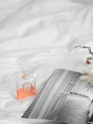 Chanel Mademoiselle Perfume With Magazine Wallpaper