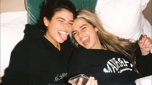 Charli And Addison Lying On The Bed Wallpaper