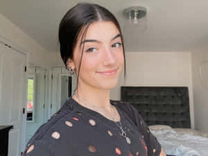 Charlie Damelio Beaming With Joy Wallpaper