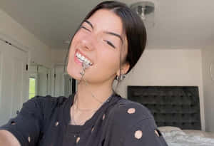 Charlie Damelio Enjoying A Fun Day Out! Wallpaper