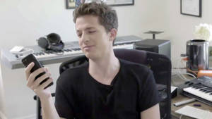 Charlie Puth Using Cellphone Wallpaper