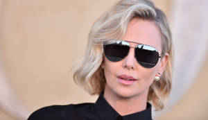 Charlize Theron In One Of Christian Dior Show Wallpaper