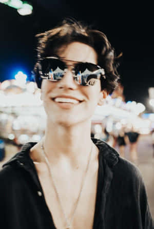 Chase Hudson Aviator Glasses And Unbuttoned Shirt Wallpaper