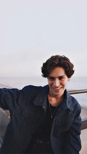 Chase Hudson Taking A Leisurely Walk In The Park Wallpaper