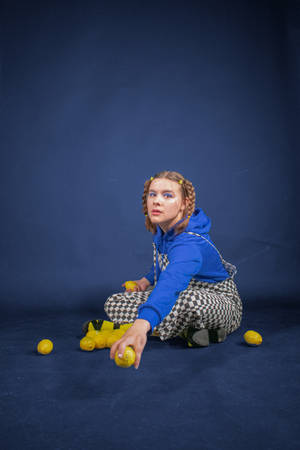 Checkered Jumpsuit Girl With Lemons Wallpaper