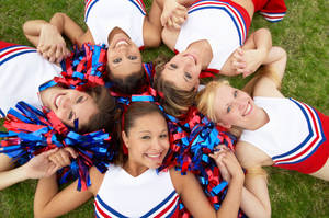 Cheerleading On Grass Wallpaper