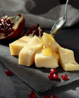 Cheese With Syrup And Pomegranate Wallpaper
