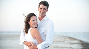 Chesson Hadley With Wife On Beach Wallpaper