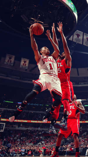 Chicago Bulls Star Derrick Rose Goes For A Layup Wallpaper