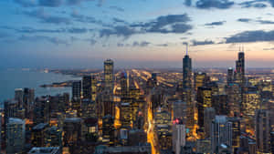 Chicago City Night With Dark Clouds Wallpaper