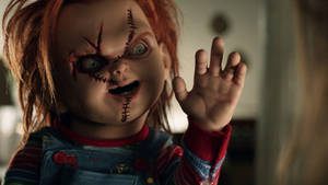 Child's Play Waving Chucky Wallpaper