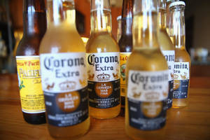Chilling Corona Extra And Pacifico Clara Bottles Wallpaper