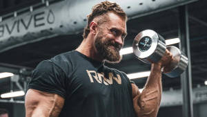 Chris Bumstead Lifting Heavy Dumbbell Wallpaper