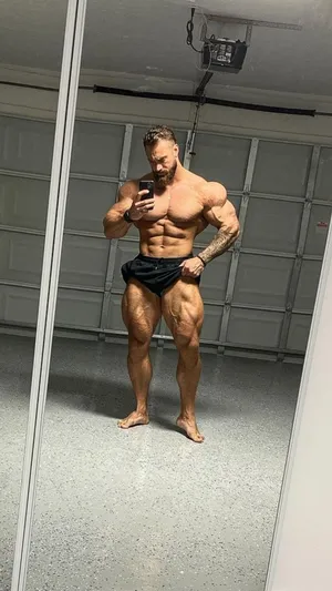 Download Chris Bumstead Double Front Bicep Pose Wallpaper