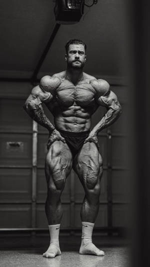 Chris Bumstead With Veins Popping Out Wallpaper