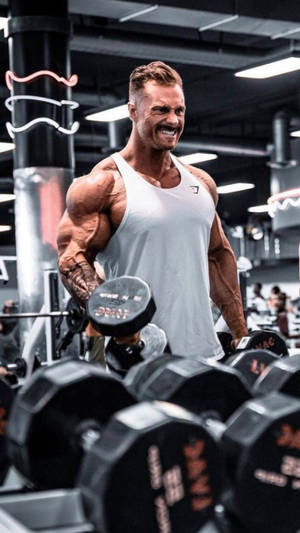Chris Bumstead With White Tank Top Wallpaper