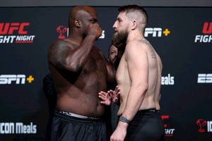 Chris Daukaus And Derrick Lewis Face-to-face Wallpaper