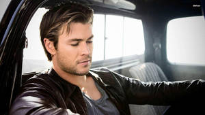 Chris Hemsworth In The Car Wallpaper